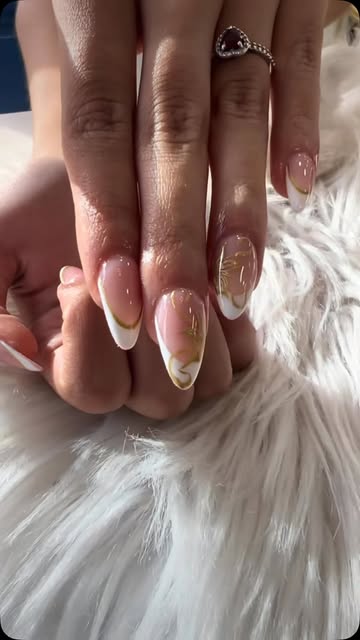 French tips with delicate gold detailing by Foxy Nails and Spa